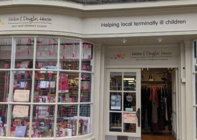 Abingdon shop window with pink items and banners