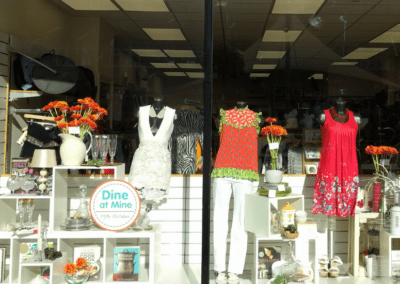 Woodley shop front with Helen & Douglas House logo