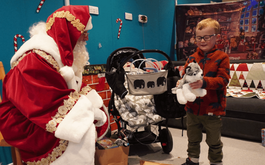 Christmas party santa with child and toy at HDH_1500x700