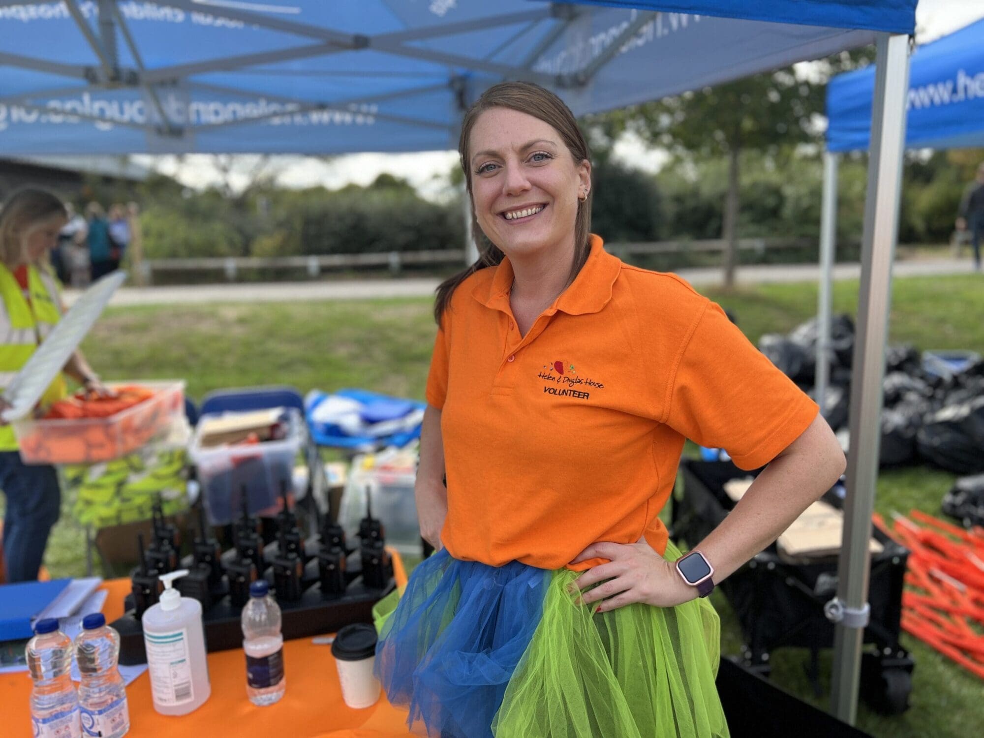 A photo of Helen volunteering at a Helen & Douglas event