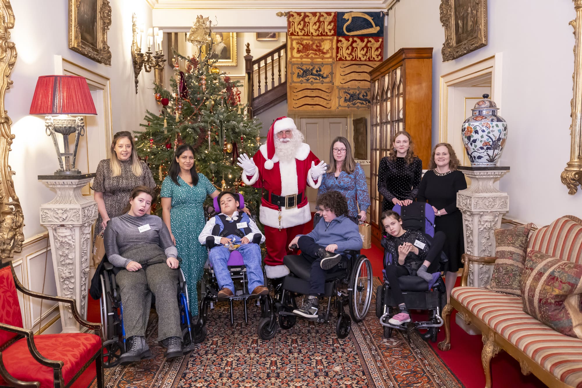 IJP-12-12-24-CHTree-0223 Families stood with Santa by the tree at Clarence House