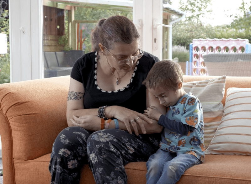 Finley and Michaela sitting on the sofa together