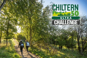 Chiltern Ultra Challenge Two women hiking through a sunlit forest