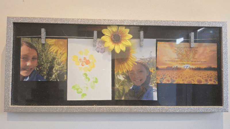 Two photos - on the left a girl smiling next to a sunflower and on the left, a girl smiling holding a dog in a woods.