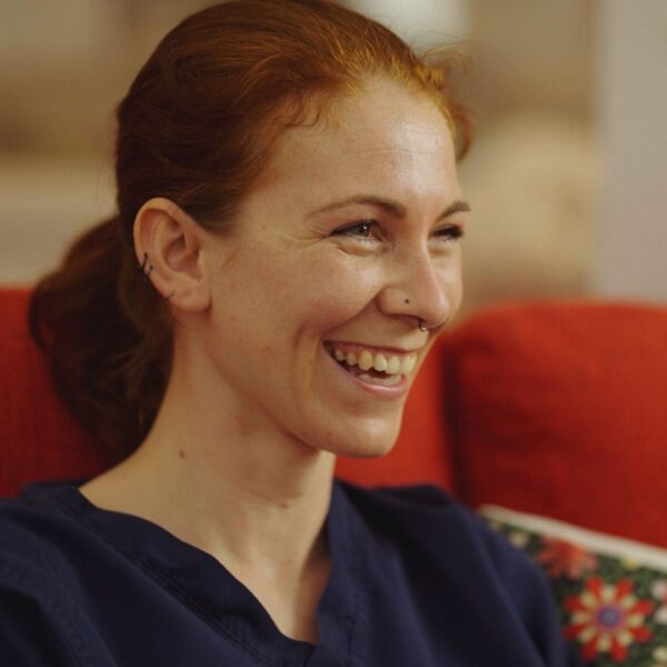 David is smiling in the garden. 