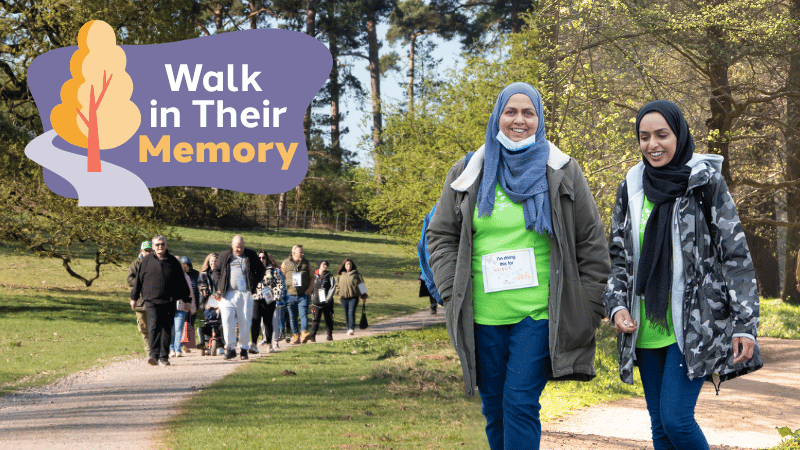 Groups of men, women and children walking along paths through nature.
