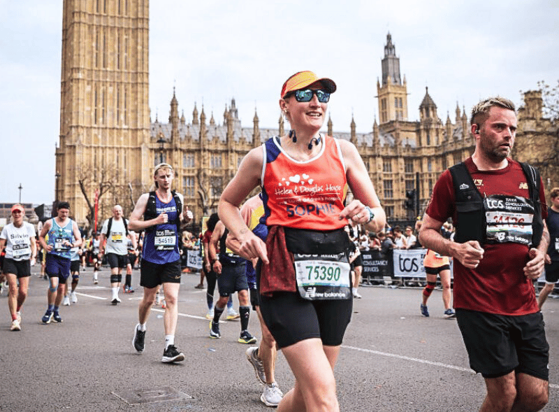 A woman running past Big Ben