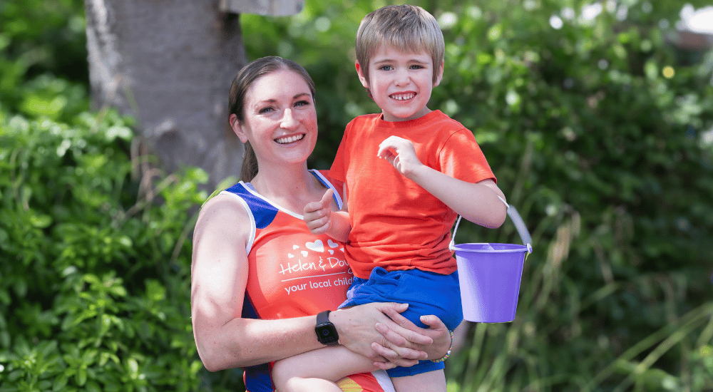 Oxford Half team webpage A woman holding her son.